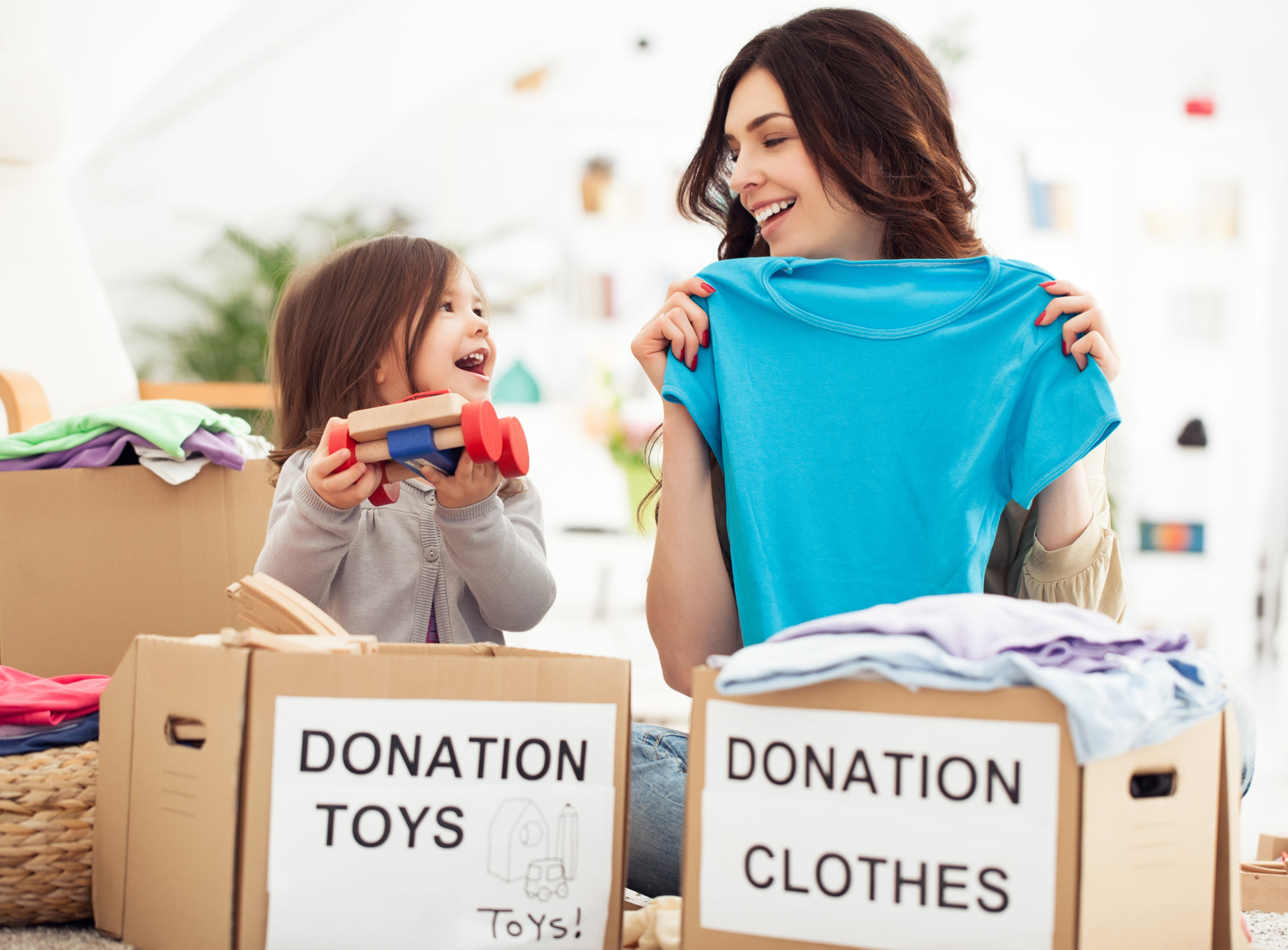 woman and child sorting donations